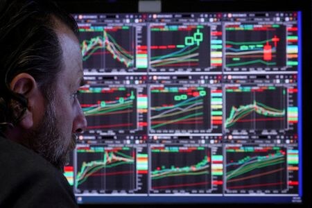 FILE PHOTO: A specialist trader works on the floor of the New York Stock Exchange (NYSE) in New York City, U.S., October 17, 2022. REUTERS/Brendan McDermid/File Photo