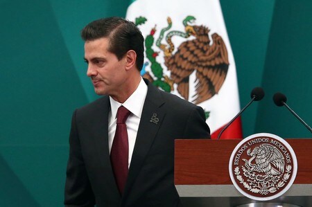 　４月９日、メキシコ政府は、米国との協力関係を全ての側面から再検証する方針を明らかにした。不法移民の問題などでトランプ大統領が同国への敵対姿勢を鮮明にしているため、けん制した格好だ。写真はメキシコのペニャニエト大統領。３月にメキシコシティで撮影（２０１８年　ロイター／Edgard Garrido）