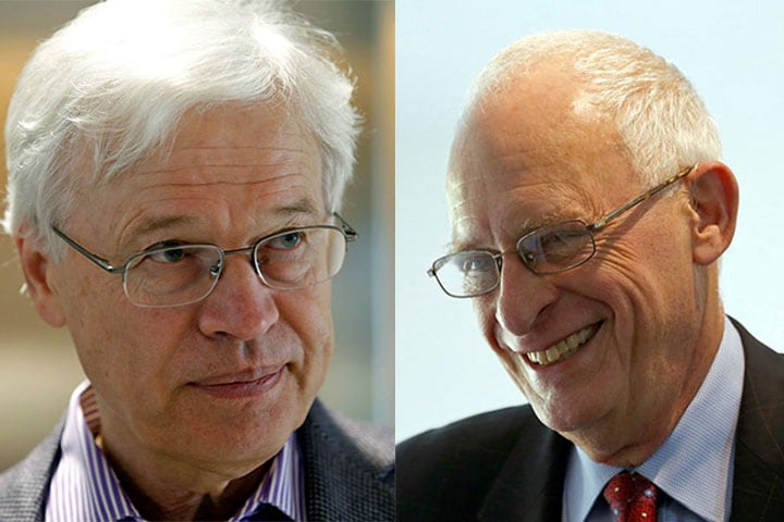 ノーベル経済学賞を受賞したホルムストルム（左）とハート　Mary Schwalm-REUTERS