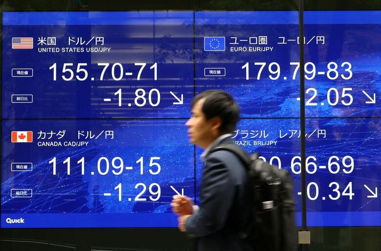 8月3日、都内の為替ボード前で撮影。 REUTERS/Issei Kato