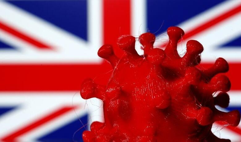 ジョンソン英首相は、ロンドンを含めたイングランド地域で新型コロナウイルス感染対策として実施しているロックダウン（都市封鎖）を19日に全面解除し、経済活動を再開させる方針だ。写真は英国旗とコロナウイルスのイメージ。2020年3月撮影（2021年　ロイター/Dado Ruvic）