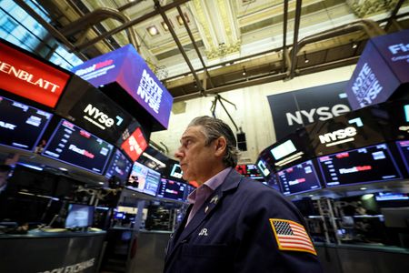 FILE PHOTO: Traders work on the floor of the New York Stock Exchange (NYSE) in New York City, U.S., August 15, 2023.  REUTERS/Brendan McDermid/File Photo