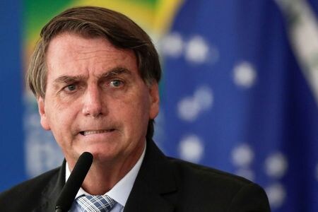 　３月１７日　ブラジルのボルソナロ大統領（写真）は支持者が新型コロナウイルス感染抑制のための社会的距離（ソーシャルディスタンス）に反発して抗議運動を行なっていることに満足していると述べた。３月１０日、ブラジリアで撮影（２０２１年　ロイター/Ueslei Marcelino）