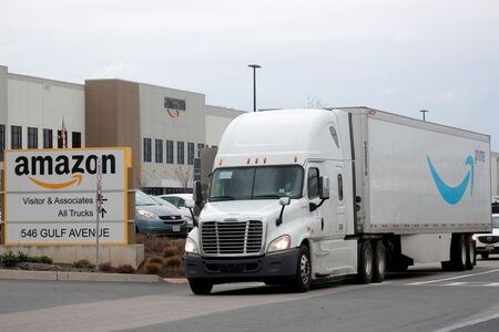FILE PHOTO: An Amazon truck exits the company\'s JFK8 distribution center in Staten Island, New York, U.S. November 25, 2020.  REUTERS/Brendan McDermid./File Photo