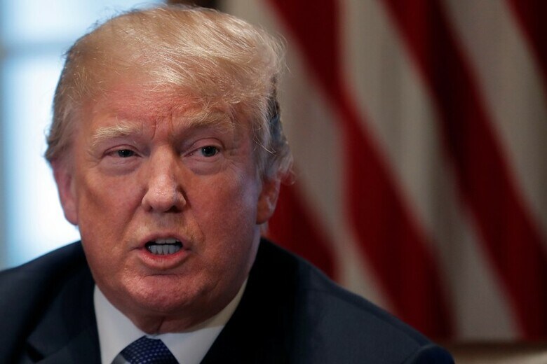４月９日、米連邦捜査局（ＦＢＩ）はトランプ大統領（写真）の顧問弁護士であるマイケル・コーエン氏の自宅や事務所など関係先を捜索し（２０１８年　ロイター/Carlos Barria）