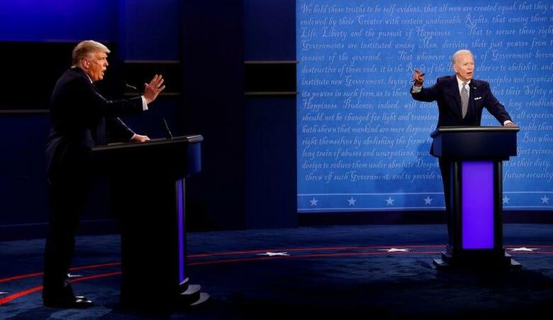 ラットクリフ米国家情報長官は21日、ロシアとイランが今年の米大統領選への介入を試みたとの見解を示した。写真は9月の第1回討論会(2020年　ロイター/Brian Snyder)