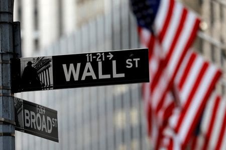 American flags hang from the facade of the New York Stock Exchange (NYSE) building after the start of Thursday\'s trading session in Manhattan in New York City, New York, U.S., January 28, 2021. REUTERS/Mike Segar