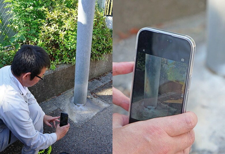 調査アプリ「LD-Map」のデモンストレーションで街路灯の接地面を撮影する新居浜市職員（7月24日）　PHOTO：TOMOHIRO IWANABE-NEWSWEEK JAPAN