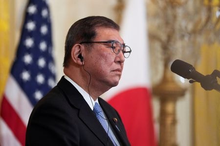石破茂首相は７日（日本時間８日）、日米首脳会談後の共同会見で、為替について「第１次トランプ政権時と同様に専門家である日米の財務大臣の間で緊密な議論を継続させていくことにした」と述べた。２月７日、米ワシントンのホワイトハウスで撮影（２０２５年ｍ　ロイター/Kent Nishimura）