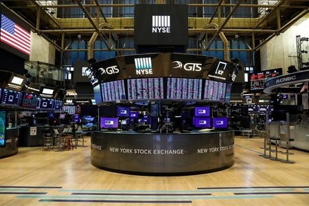 A nearly empty trading floor is seen as preparations are made for the return to trading at the New York Stock Exchange (NYSE) in New York, U.S., May 22, 2020. REUTERS/Brendan McDermid