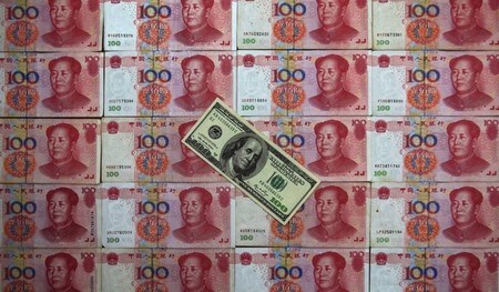　１２月１４日、中国人民銀行（中銀）の複数の高官は、人民元を防衛する用意があることを示唆、中国経済が安定すれば将来の下落圧力が弱まるとの認識を示した。写真は北京で２０１３年５月撮影（２０１６年　ロイター／Petar Kujundzic）