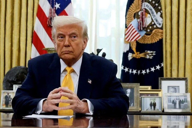 FILE PHOTO: U.S. President Donald Trump sits in the Oval Office of the White House in Washington, D.C., U.S., March 7, 2025.