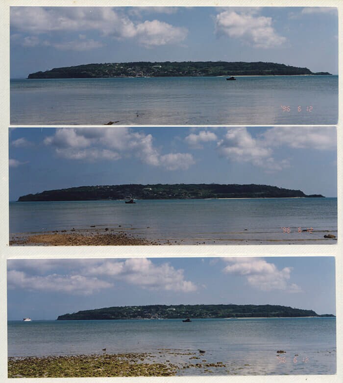 沖縄愛楽園入所者提供の写真アルバムより。アルバムには療養所から向かいにのぞむ古宇利島を撮影した写真が並ぶ。日付は「らい予防法」が廃止された1996年。次のページには2000年代に同じ場所から撮影された古宇利島の写真が配置されている