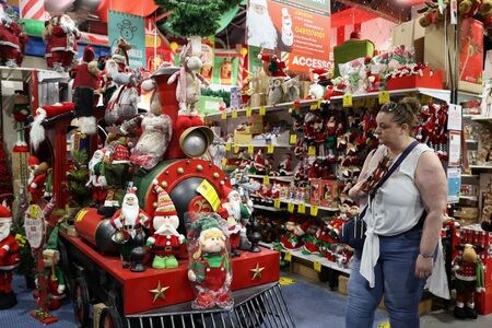 FILE PHOTO: A customer shops inside a Christmas store as coronavirus disease (COVID-19) regulations are further eased for the state of New South Wales in Sydney, Australia, November 26, 2020.  REUTERS/Loren Elliott