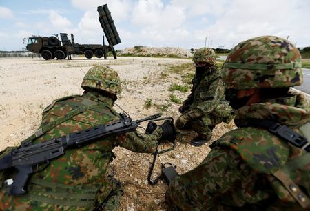 Members of the Japan Ground Self-Defense Force (JGSDF) conduct a military drill next to an anti-ship missiles unit, at JGSDF Miyako camp on Miyako Island, Okinawa prefecture, Japan April 21, 2022. Picture taken April 21, 2022. REUTERS/Issei Kato