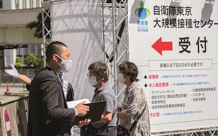 日本のワクチン接種が一挙に加速して、東京五輪中止論者を黙らせる？　KIM KYUNG HOONーREUTERS