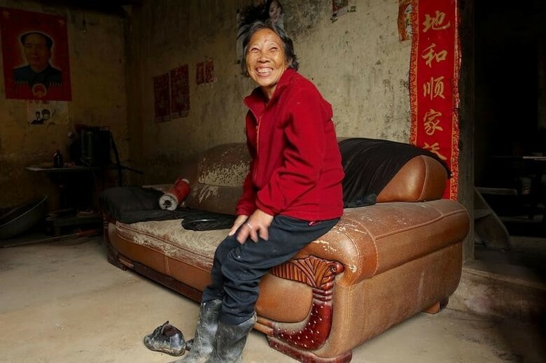 　湖南省 Furong村の自宅で取材に応じるZhao Fenglingさん。２０１８年５月撮影（２０１８年　ロイター/Ryan Woo）