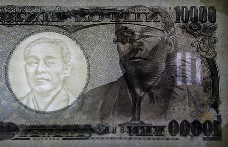 　６月１６日、日銀が金融政策決定会合後に政策維持を公表し、東京市場では大幅な円高・株安が進んだ。２０１５年１１月撮影（２０１６年　ロイター/Thomas Peter/File Photo）