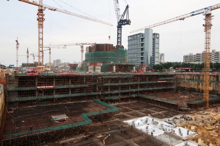 Workers are seen at the construction site of the south tower of the Haikou Twin Tower project in Hainan province, China January 10, 2018. REUTERS/Matthew Miller