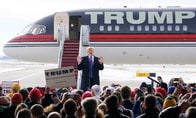 米大統領選、アイオワ党員集会は民主・共和とも大接戦