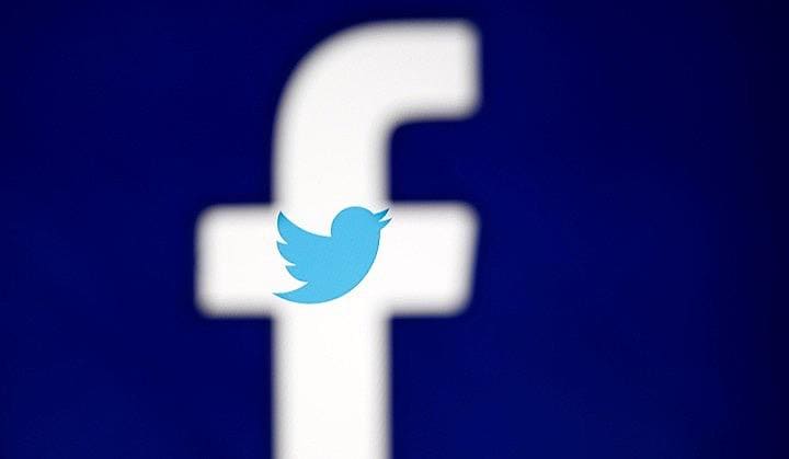 香港で続く大規模デモを巡り、米ツイッターとフェイスブックがデモを妨害する中国政府の関与が疑われる不正アカウントを削除したことを受け、中国政府は中国には国の見解を示す権利があると主張した。写真はフェイスブックとツイッターのロゴ。2017年10月撮影（2019年　ロイター/Dado Ruvic）