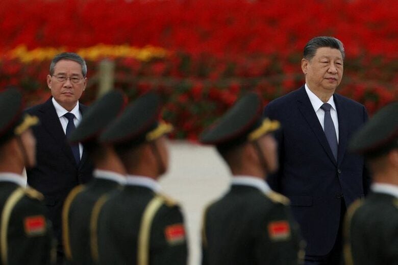 中国の李強首相と、習​近平⁠国家主席。2026年9月30日、北京で撮影。REUTERS/Florence Lo