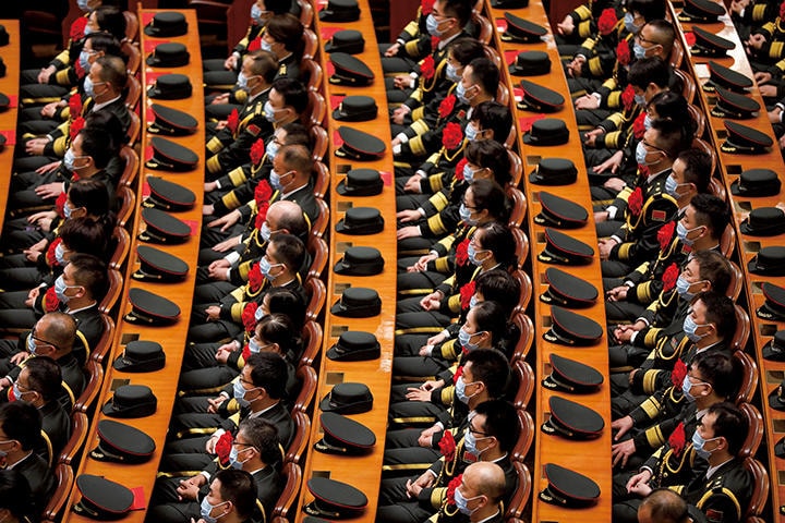 中国は国家再生というビジョンの下で結束を図る（2020年9月、北京で開かれた新型コロナ感染対策表彰大会）　CARLOS GARCIA RAWLINS-REUTERS