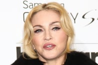 谷間が丸出し...際どいピンク下着で床を這う「無加工」マドンナにファン衝撃　「脚を閉じて」「誰も見たくない」と批判も