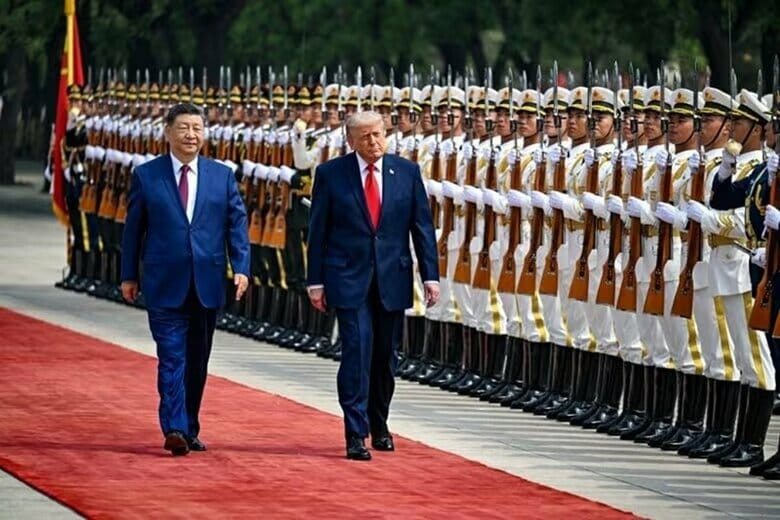 写真は5月14日、北京の人民大会堂前で行われた歓迎式典に臨むトランプ米大統領と中国の習近平国家主席。代表撮影。REUTERS