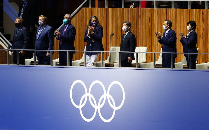 東京五輪の開会式。天皇陛下の開会宣言の際、菅がすぐに起立しなかったことも保守派の不興を買った　Mike Blake-REUTERS