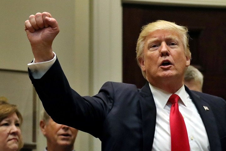 どんなに議論しても、結局、選挙公約に戻ってしまうトランプ大統領　Carlos Barria-REUTERS