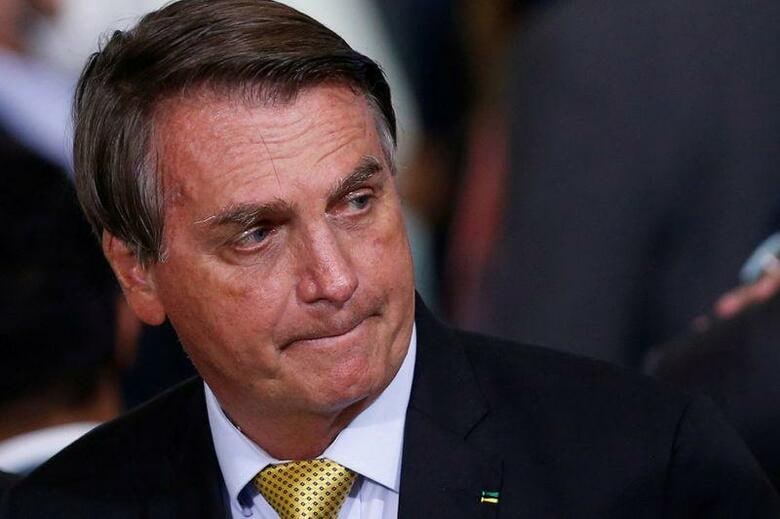 ブラジルのボルソナロ大統領は１４日、慢性的なしゃっくりの原因を調べるために入院した。６月２９日、ブラジリアで撮影（２０２１年　ロイター／Adriano Machado/File Photo）