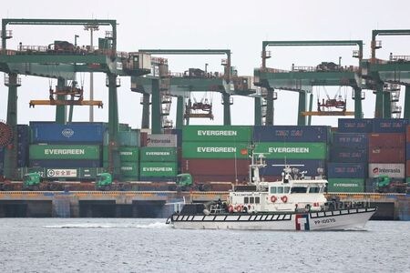 FILE PHOTO: A coast guard ship sails at the Port of Taipei in Taipei, Taiwan February 9, 2021. REUTERS/Ann Wang