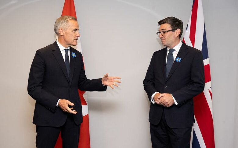 写真はカナダのカーニー首相とバーナム英首相。9月16日、英マージーサイド州エバートンで代表撮影。REUTERS