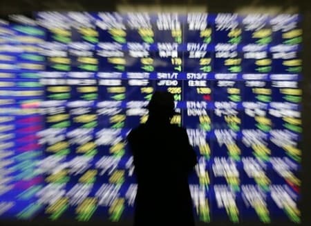 　６月１０日、原油価格の上昇基調を背景に世界的なリスク志向は健在だが、日本株はほとんど恩恵を受けず、レンジ相場が長期化している。写真は都内で２０１４年１月撮影（２０１６年　ロイター／Issei Kato）