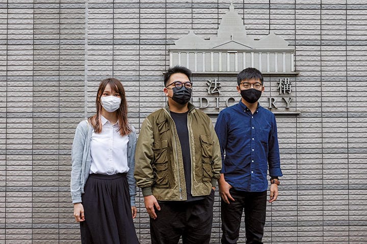 12月2日に実刑判決を言い渡された香港の3人の若い民主活動家──左から周庭、林朗彦、黄之鋒　TYRONE SIU-REUTERS
