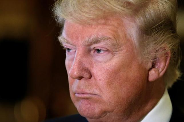 １月１５日、トランプ次期米大統領は英紙タイムズとのインタビューで、ロシアのプーチン大統領が核兵器の削減に合意すれば、対ロシア経済制裁の解除を提案する考えがあると語った。写真は９日ニューヨークのトランプ・タワーで撮影（２０１７年　ロイター／Mike Segar）