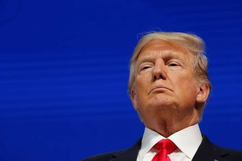 １月２７日、トランプ米大統領は今月３０日に初めての一般教書演説に臨む。１時間を予定する演説のテーマは「安全で強く、誇り高き米国の構築」。写真は世界経済フォーラムに参加した同大統領。２６日にダボスで撮影（２０１８年　ロイター／Carlos Barria）